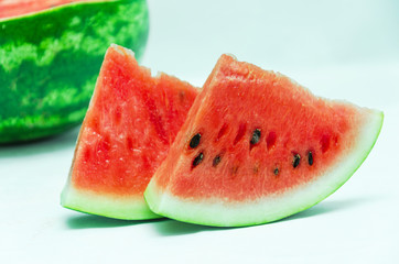 slices of watermelon on a light background, watermelon