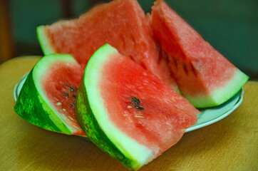 sliced ​​slices of sweet watermelon, background with slices of watermelon
