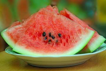 sliced ​​slices of sweet watermelon, background with slices of watermelon