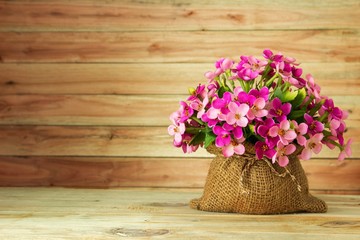 Fototapeta na wymiar bouquet of flowers on a wooden background