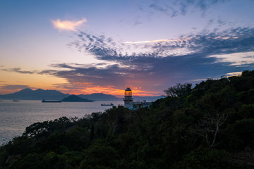 Fototapeta na wymiar Lighthouse of Victoria Harbour at dusk