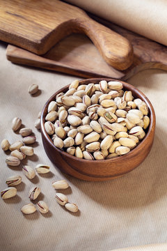 Salted pistachio in wooden bowl 