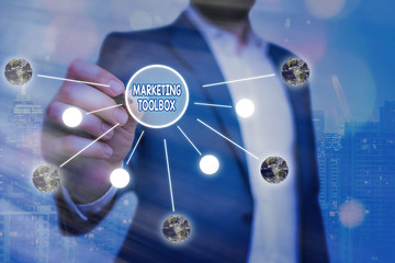 Conceptual hand writing showing Marketing Toolbox. Concept meaning Means in promoting a product or services Automation Elements of this image furnished by NASA