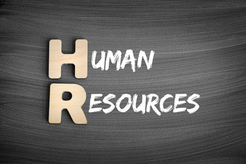 HR - Human Resources acronym, business concept on blackboard