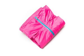 Folded pink zipper windbreaker jacket, rain proof jacket hoodie. Track jacket sport shiny nylon full zip isolated on white. Folded clothes.