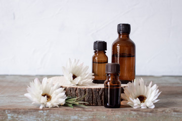 a bottle of aroma oil on a wooden table