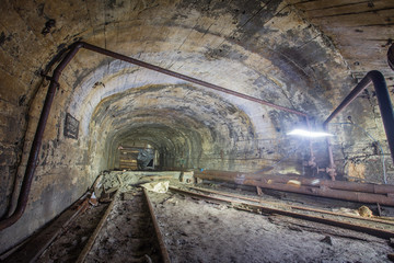 Fototapeta na wymiar Underground old abandoned iron mine tunnel 