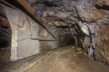 Underground old abandoned iron mine tunnel