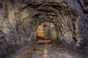 Underground abandoned iron ore mine tunnel with door
