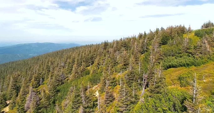 Aerial view of the top of mount Serak where is a tourist wooden cottage