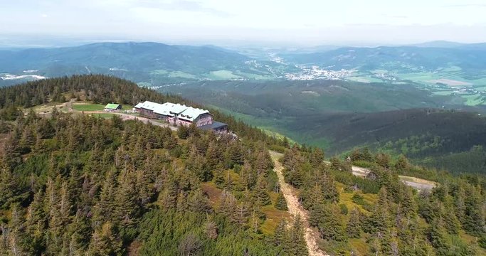 Aerial view of the top of mount Serak where is a tourist wooden cottage
