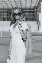 Stylish girl with long hair wears glasses