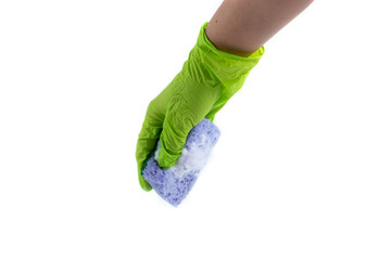 Fototapeta na wymiar Sponge for dishes in a female hand in a green glove isolated on a white background. Copy space.