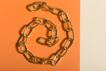 Women's Jewelry. Trendy jewelry on coloured background. Flat lay, top view.