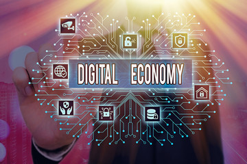 Writing note showing Digital Economy. Business concept for worldwide network of economic activities...