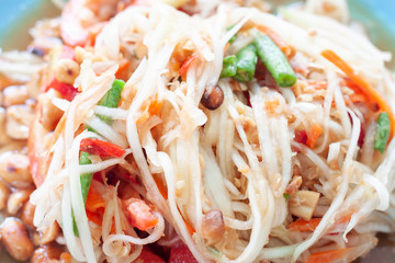 Closeup papaya salad is Thai people call Som tam Thai in plate.