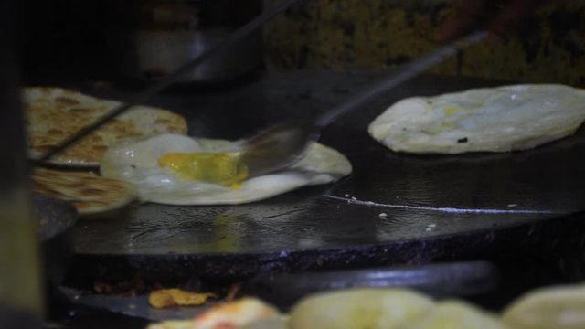 Close up shot of famous Kolkata Egg Roll preparation 