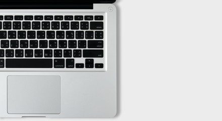 Isolated top view laptop on white background for text space with thai keyboard.