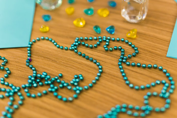 Perfume bottle and accessories on the table. Beauty and lady's concept.