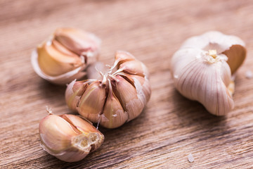 Organic garlic whole on the wooden background close-up.