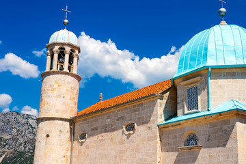 Amazing view of the church with a blue bath on the island of the Virgin on a reef in the Bay of Kotor, Montenegro