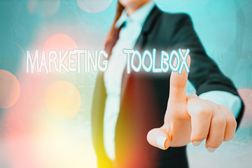 Writing note showing Marketing Toolbox. Business concept for Means in promoting a product or services Automation