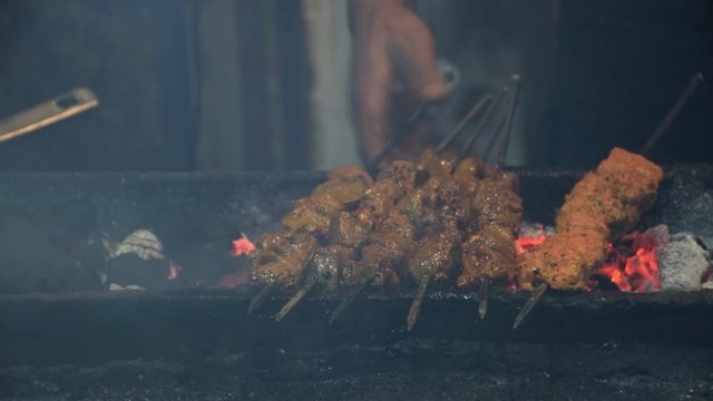 Closeup shot of variety of Kebabs being prepared at a restaurant in India