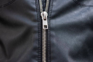 metal zipper on black leather jacket © mimagephotos