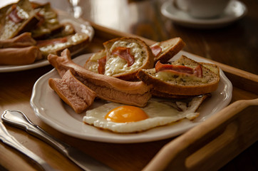 
morning breakfast fried egg with sausage and croutons