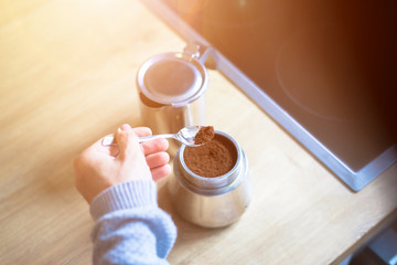 Preparing fresh coffee with a vintage steal coffee cooker
