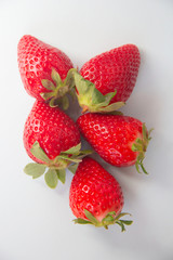 Flat lay composition with with tasty ripe strawberries on light background