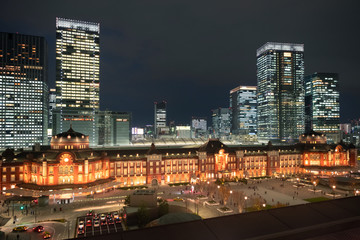 Tokyo Station and skyscrapers in the Marunouchi business district area in Tokyo, Japan during twilight hours