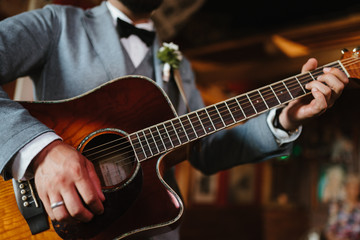Obraz na płótnie Canvas photo of a man playing the guitar