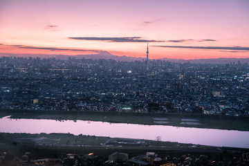 Tokyo skyline during twilight hours and the view of Mount Fuji