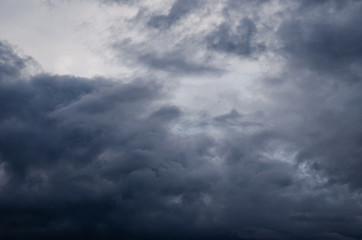 
dark clouds in the sky above the park