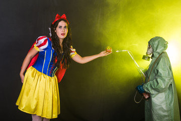 Woman dressed as fairytale character holds Radioactive atomic nuclear ionizing radiation danger...