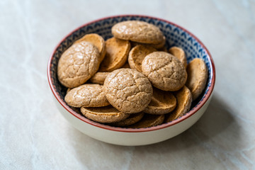 Chewy Soft Italian Amaretti Cookie Biscuits in Ceramic Bowl.