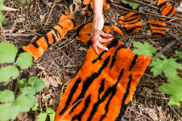 Stop animal killing concept - Close-up of woman show animal skin that she wants to tell someone don't kill animals or stopped violence against animal.