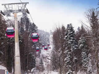 A cablaway with cable cars in a mountain area