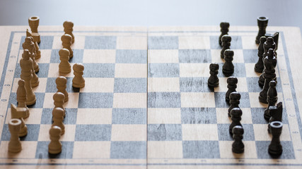 Chess pieces on the chess board with selective focus. Business and motivation concept.