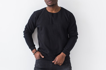 Street fashion concept - Studio shot of young handsome Close-up of African man wearing sweatshirt...