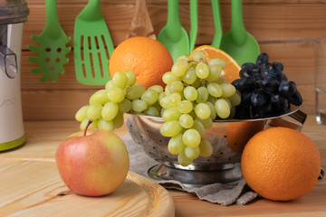 Fresh fruits on a wooden background, cutting wooden board and knife