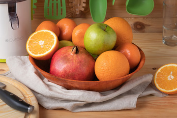 Fresh fruits on a wooden background, cutting wooden board and knife