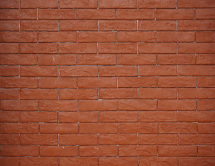 New brick wall in terra cotta color for background and object ideas.  Copy space.  Material, building construction, background and textures.