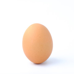 Close-up top view of organic Single raw eggs in egg box on white background with copy space for your text, healthy eating concept.