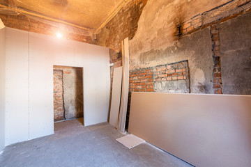 Working process of installing frames for plasterboard - drywall and construction tools in apartment...