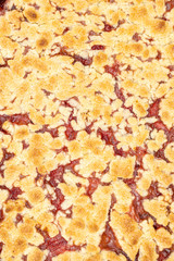 Top view of Strawberry cake baked in the baking tray on the grey marble table