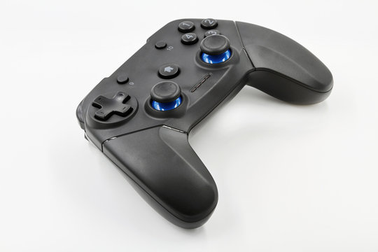 Gamepad on a white background. Game Joystick. Closeup, selective focus
