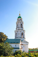 Fototapeta na wymiar The bell tower of the Mgar Orthodox monastery (Savior-Transfiguration). It was founded on January 18, 1619. Famous place near Lubny of Poltava region. Ukraine. Religion, XVII century.
