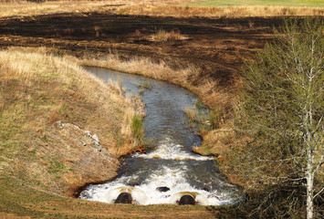 Discharge of waste water into the river. Violation of environmental ecology.